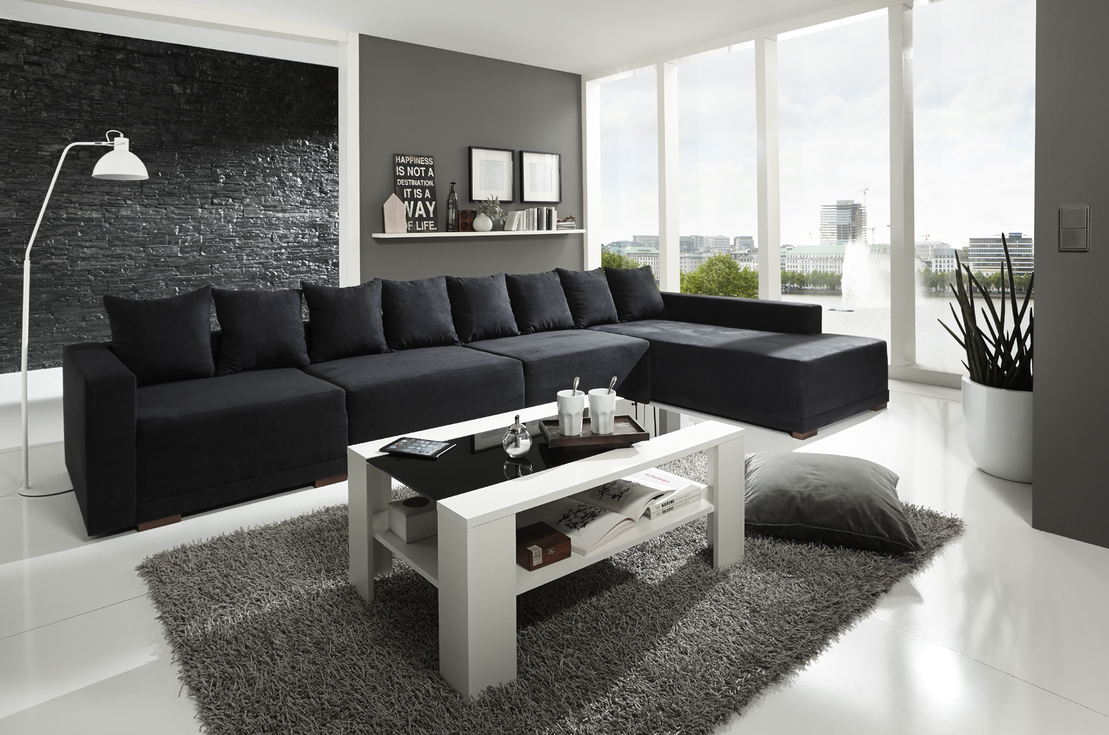 wohnzimmer schwarze couch